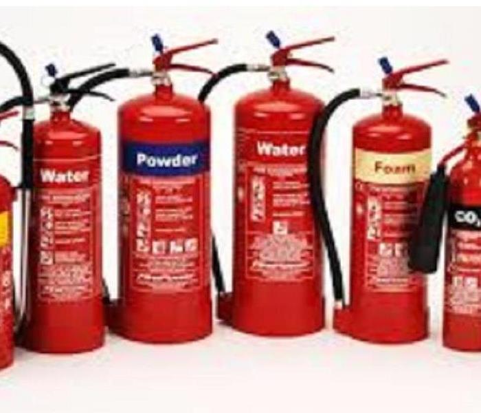 Four red fire extinguishers