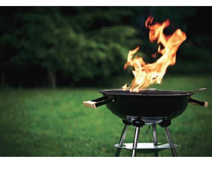 BBQ grill with flames coming out of it